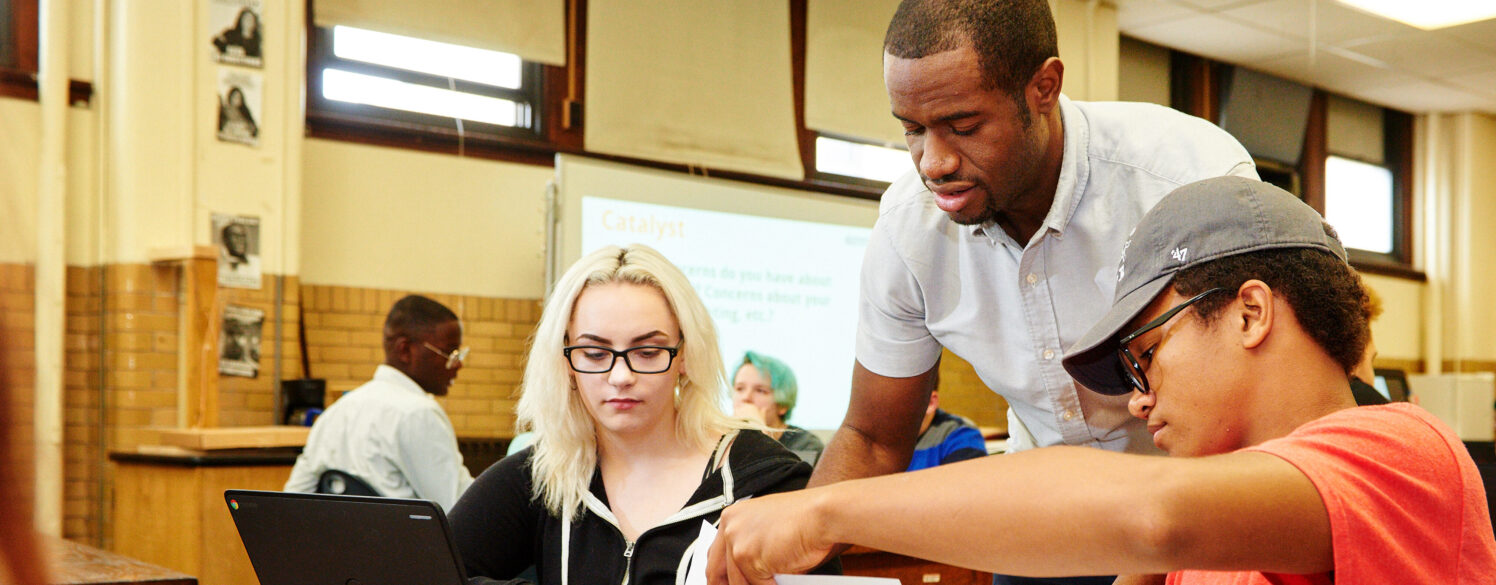 Teaching Fellow and students discussing project at Knowles Teacher Initiative